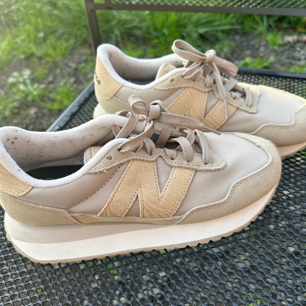 Women’s New Balance size 7 shoes.